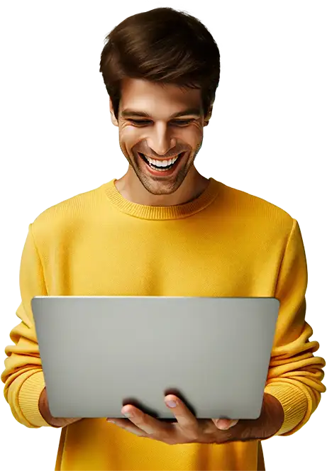youg man in yellow jumper happily looking at his laptop and seing how great the seo is on his newly developed website